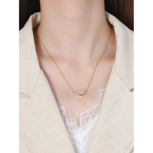 S925 sterling silver cloud necklace with zircon pendant worn with beige suit