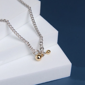S925 sterling silver ball necklace featuring a mixed silver chain and gold-toned T-bar accent