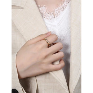 Elegant gold bamboo joint ring in S925 sterling silver worn with minimalist chic outfit