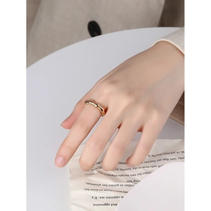 Modern gold-plated S925 sterling silver ring with irregular bamboo-style wave texture