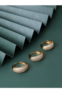 Detailed macro shot of S925 sterling silver stamp on golden pavé zircon ring
