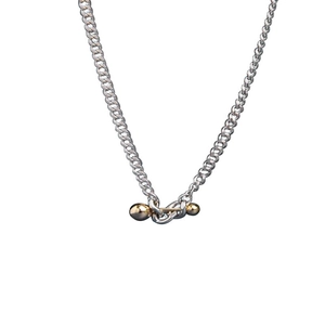 Minimalist S925 silver necklace featuring a contrasting gold ball balance bar closure
