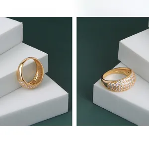 Close-up of gold-plated S925 silver ring with pave-set zircon stones and inner hallmark