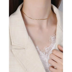 Elegant gold S925 sterling silver pig nose chain necklace worn with chic beige blazer