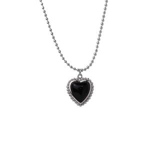 Minimalist black heart agate necklace with bead chain design on a white background