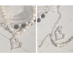 Detail of S925 sterling silver lobster clasp and freshwater pearl heart pendant necklace