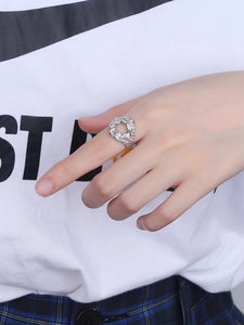 Detail view of silver S925 lava texture irregular open ring worn on finger
