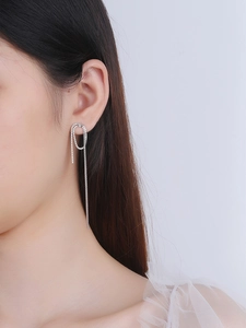Detail view of S925 silver long fringe earrings with oval hoop and box chain tassels