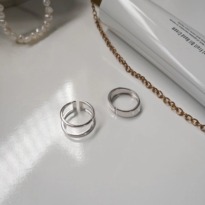 Detailed close-up showing the S925 sterling silver hallmark on minimalist layered rings