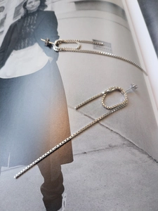 Detail shot of S925 sterling silver long box chain drop earrings with polished finish
