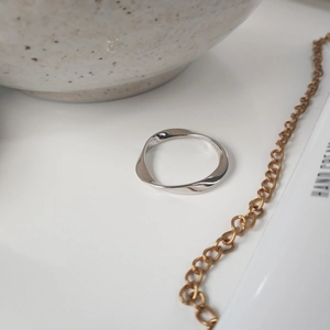 Detailed macro shot of S925 sterling silver Mobius ring showing inner authenticity hallmark