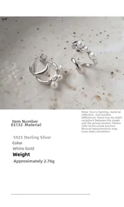 Detail of S925 sterling silver pearl stud earrings with double curved streamline design