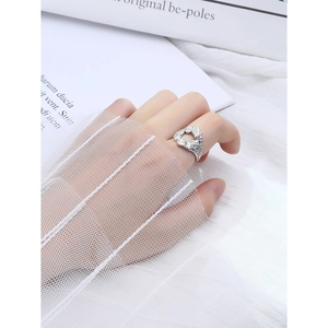 Minimalist S925 sterling silver ring with molten lava texture on model hand