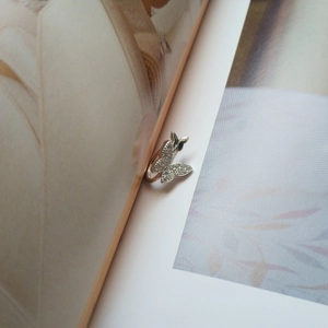 Detail of S925 sterling silver butterfly ear cuff with sparkling zircon stones