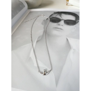 Elegant S925 sterling silver crown necklace displayed on a creative portrait background