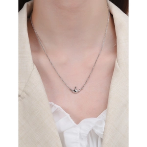 Elegant S925 sterling silver crown pendant necklace worn on neck for a chic look