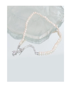 Detail of freshwater pearl necklace with heart crystal pendant and silver T-bar toggle clasp