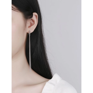 Minimalist S925 sterling silver chain tassel earrings worn by a female model