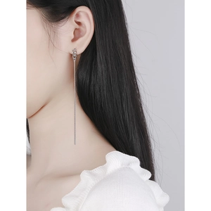 Elegant S925 sterling silver tassel chain earrings worn by a model on grey background