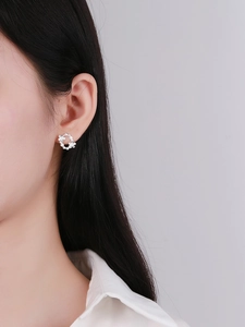 Detailed view of S925 sterling silver hoop earrings with intricate floral petal design