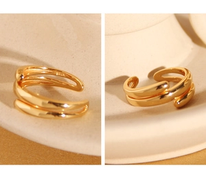 Detailed macro view of S925 sterling silver multi-layer gold ring with hallmark engraving