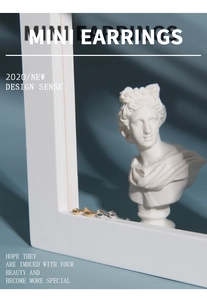 Close-up of minimalist gold and silver mini stud earrings on a decorative frame