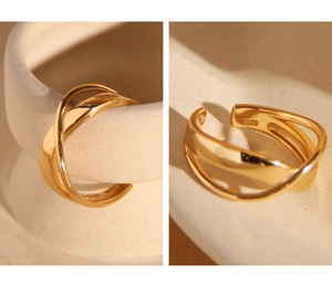 Detailed close-up showing the S925 silver stamp on gold criss-cross minimalist ring