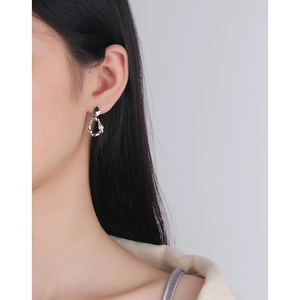 Irregular silver hoop earrings with white pearl accent for a minimalist elegant style