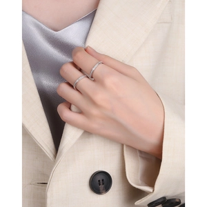 Close-up of elegant S925 sterling silver rings with micro-pave zircon on a model hand