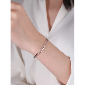 Minimalist S925 sterling silver double-layer bracelet with bar charm on model wrist