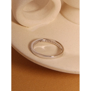Close-up of S925 sterling silver ring with a half-band of sparkling cubic zirconia