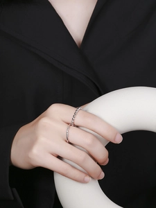 Detail of stacked S925 sterling silver beaded and twisted rope minimalist rings