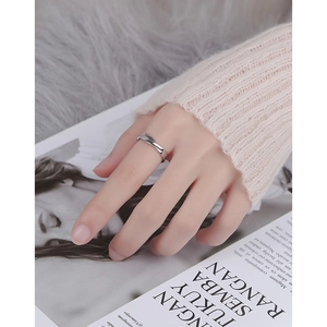 Elegant s925 silver twisted rope open ring worn with a soft pink mohair sweater style
