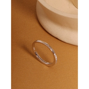 Detailed macro view of S925 sterling silver ring with cubic zirconia stones and hallmark