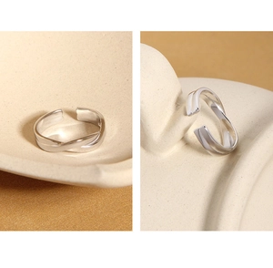 Detail of twisted s925 sterling silver ring showing texture and adjustable open design