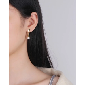 Minimalist S925 sterling silver gold earrings with elegant white pearl drop on model