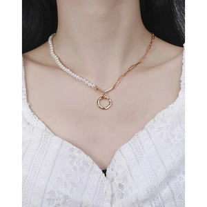 Elegant S925 silver necklace featuring pearls and golden links on a female model