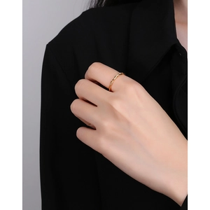 Minimalist S925 sterling silver twisted rope ring shown on model's index finger