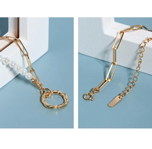 Close-up of S925 sterling silver hallmark on gold-plated pearl paperclip chain necklace