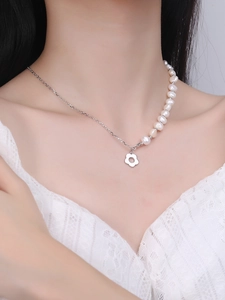 Close-up of S925 silver necklace with asymmetric freshwater pearls and flower pendant