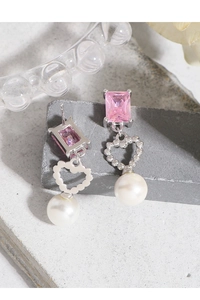 Detailed close-up of S925 silver earrings with pink rectangular gem and pearl drops