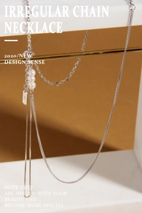Macro view of S925 sterling silver irregular chain necklace with three round pearls