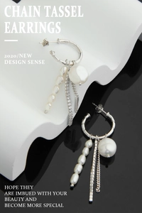 Macro detail of S925 silver fringe earrings with baroque pearls and zircon chains
