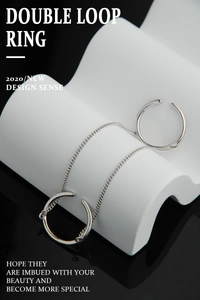 Detail of S925 sterling silver double-layer chain ring on a white wave display