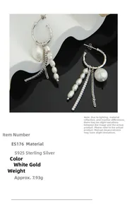 Macro detail of S925 sterling silver chain tassel earrings with pearls and zircons