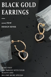 Macro detail of black heart onyx stud earrings with gold bamboo texture and white zircon