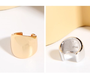 Detail of S925 sterling silver ear cuffs with polished finish and engraved hallmark