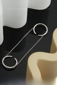 Close-up of S925 sterling silver minimalist double ring with thin curb chain link