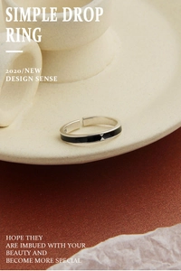 Macro view of S925 sterling silver ring featuring black enamel diamond-shaped accents