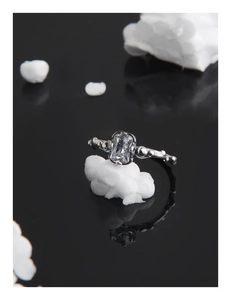 Macro view of vintage S925 silver ring featuring rectangle zircon and beaded band details